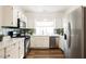 Bright kitchen with stainless steel appliances and white cabinets at 6808 Indian Chief Dr # 204, Las Vegas, NV 89130