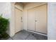 Entrance to an apartment with two doors, offering storage and entry, near green landscaping at 6808 Indian Chief Dr # 204, Las Vegas, NV 89130