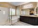 Bright bathroom with a separate shower and tub as well as and sinks at 6897 Linda Creek Ct, Las Vegas, NV 89178
