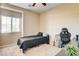 Cozy bedroom with carpeted floors, neutral walls, and a ceiling fan at 6897 Linda Creek Ct, Las Vegas, NV 89178