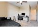 Bedroom featuring carpet, neutral walls, a ceiling fan, and a workspace at 6897 Linda Creek Ct, Las Vegas, NV 89178