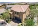 Spacious two-story home with well-maintained landscaping, a two-car garage, and a charming red-tile roof at 6897 Linda Creek Ct, Las Vegas, NV 89178