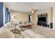 Spacious living room with carpet and plush seating arrangement, perfect for relaxing and entertaining at 6897 Linda Creek Ct, Las Vegas, NV 89178