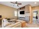Living room with modern media center and comfortable seating, bathed in natural light at 6897 Linda Creek Ct, Las Vegas, NV 89178