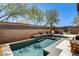 Relaxing backyard pool with adjacent patio and outdoor seating, perfect for entertaining guests at 6897 Linda Creek Ct, Las Vegas, NV 89178
