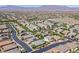 Expansive aerial view of a suburban community with well-maintained homes and mountain views at 7033 Twin Forks Peak St, Las Vegas, NV 89166