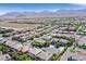 Sweeping aerial view of housing community with mountain views and desert landscape backdrop at 7033 Twin Forks Peak St, Las Vegas, NV 89166
