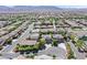 Scenic aerial shot showcases a neighborhood with desert landscaping, mountain views, and varied home styles at 7033 Twin Forks Peak St, Las Vegas, NV 89166