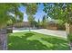 Lush backyard featuring a pool, gazebo, and artificial turf, ideal for outdoor enjoyment at 7033 Twin Forks Peak St, Las Vegas, NV 89166