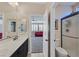 Bathroom featuring double sinks with bronze faucets and an entry to the bonus room at 7033 Twin Forks Peak St, Las Vegas, NV 89166