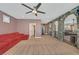 Spacious bonus room featuring stone archways, carpet floors, and ample natural light at 7033 Twin Forks Peak St, Las Vegas, NV 89166