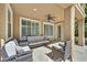 Comfortable covered patio with plush seating, creating an ideal outdoor living space at 7033 Twin Forks Peak St, Las Vegas, NV 89166
