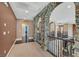Upstairs hallway with stone archways and railing at 7033 Twin Forks Peak St, Las Vegas, NV 89166