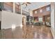 Open floor plan with wood floors and views into the kitchen area at 7033 Twin Forks Peak St, Las Vegas, NV 89166