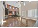 Bright, open floor plan showcases the kitchen and dining area with wood floors at 7033 Twin Forks Peak St, Las Vegas, NV 89166