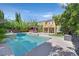 Backyard pool with a gazebo and mature trees creates a private oasis at 7033 Twin Forks Peak St, Las Vegas, NV 89166