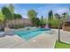 Gorgeous pool with stone accents, complemented by lush landscaping and a gazebo at 7033 Twin Forks Peak St, Las Vegas, NV 89166