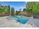 Sparkling pool with mature landscaping creates a refreshing backyard retreat at 7033 Twin Forks Peak St, Las Vegas, NV 89166