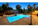 Captivating swimming pool with a raised spa and accent lighting, offering a serene retreat at 7033 Twin Forks Peak St, Las Vegas, NV 89166