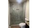 Modern bathroom shower with gray tiling and decorative inset at 761 Bourbon St # 5, Pahrump, NV 89048