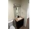 Bathroom with a vanity and a large mirror at 761 Bourbon St # 5, Pahrump, NV 89048