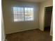 Bedroom with a large window at 761 Bourbon St # 5, Pahrump, NV 89048