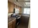 Updated kitchen with stainless steel appliances and wood cabinets at 761 Bourbon St # 5, Pahrump, NV 89048