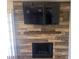 Living room with tile accent wall, fireplace, and recessed lighting at 761 Bourbon St # 5, Pahrump, NV 89048