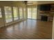 Living room with a fireplace, wood-look flooring, and sliding doors at 761 Bourbon St # 5, Pahrump, NV 89048