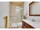 Well-lit bathroom with tile floors, glass shower, and modern vanity at 7909 Canoe Ln, Las Vegas, NV 89145