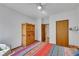 Bedroom featuring hardwood floors, and a large wooden wardrobe at 7909 Canoe Ln, Las Vegas, NV 89145