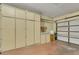 Spacious garage with built in cabinets for storage, and standard roll up door at 7909 Canoe Ln, Las Vegas, NV 89145
