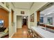 Hallway space with breakfast bar view and doorway into living spaces at 7909 Canoe Ln, Las Vegas, NV 89145