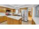Well-lit kitchen with stainless steel appliances and a kitchen island at 7909 Canoe Ln, Las Vegas, NV 89145