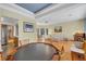 Open-concept living area with hardwood floors and natural light at 7909 Canoe Ln, Las Vegas, NV 89145