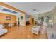 Open concept living area with hardwood floors and lots of natural light at 7909 Canoe Ln, Las Vegas, NV 89145