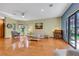 Living room with hardwood floors and sliding doors leading to the backyard at 7909 Canoe Ln, Las Vegas, NV 89145