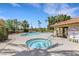 Resort-style pool area features a spa and a lounging area under a shaded patio offers the ultimate relaxation at 7909 Canoe Ln, Las Vegas, NV 89145