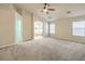 Spacious primary bedroom featuring high ceilings, ceiling fan, and carpeted floors at 7998 Base Camp Ave, Las Vegas, NV 89178