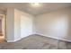 Bedroom featuring carpet flooring, sliding closet doors, base trim, and neutral walls at 7998 Base Camp Ave, Las Vegas, NV 89178
