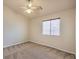 Bedroom featuring a ceiling fan, carpet flooring, base trim, and window at 7998 Base Camp Ave, Las Vegas, NV 89178