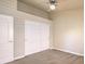 Bedroom featuring carpet flooring, base trim, sliding closet doors, and neutral walls at 7998 Base Camp Ave, Las Vegas, NV 89178
