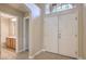 Welcoming front entryway featuring double doors, bathroom access, and bright, neutral tones creating an inviting ambiance at 7998 Base Camp Ave, Las Vegas, NV 89178