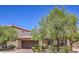 Beautiful one-story home with lush trees, desert landscaping, and a two-car garage in a desirable neighborhood at 7998 Base Camp Ave, Las Vegas, NV 89178