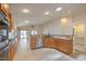 Spacious kitchen with wooden cabinets, granite countertops and stainless steel appliances at 7998 Base Camp Ave, Las Vegas, NV 89178