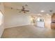 Expansive living room boasts tile flooring, ceiling fan, and versatile layout for easy customization and comfort at 7998 Base Camp Ave, Las Vegas, NV 89178