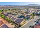 Overhead view showcases a quiet neighborhood with neat streets, diverse houses, and mountain views at 8026 Sunset Creek St, Las Vegas, NV 89113