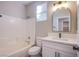 Bright bathroom featuring modern fixtures, a white vanity, and a shower-tub combo at 8026 Sunset Creek St, Las Vegas, NV 89113