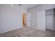 A simple bedroom features neutral carpeting and a closet with sliding doors at 8026 Sunset Creek St, Las Vegas, NV 89113