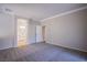Spacious bedroom with plush carpeting, doorway to the bathroom, and neutral paint at 8026 Sunset Creek St, Las Vegas, NV 89113